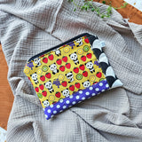 Pochette morbida recycled con impunture in cotone e similpelle, 3 fantasie