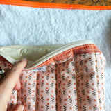 Kit nascita con fasciatoio da viaggio impermeabile, asciugamano e maxi busta fantasia tulipani