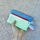 Mini pochette multiuso in tessuto tecnico impermeabile, 3 varianti
